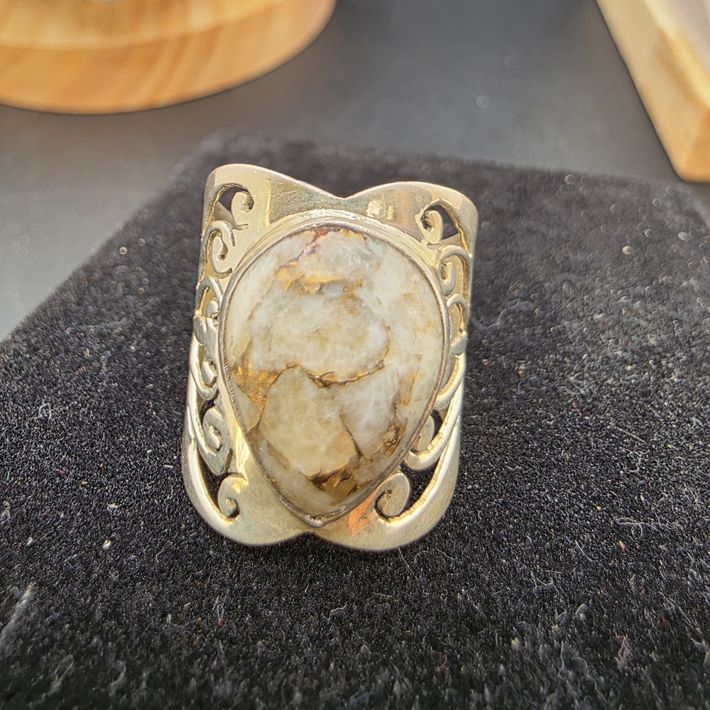 Elegant Gold and Cream Ring (2005)